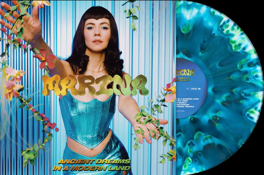 Marina Ancient Dreams In A Modern Land limited splatter vinyl record with colorful design and record label visible.