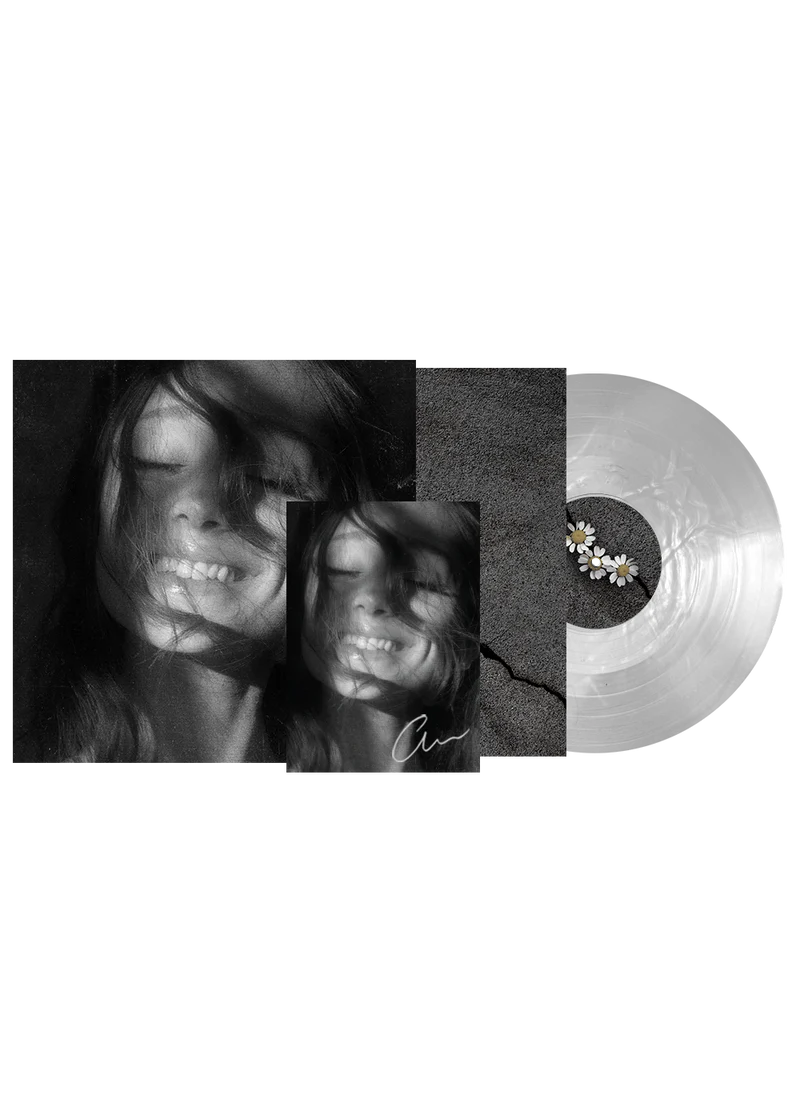 Ariana Grande Petal translucent pearly white vinyl record with signed art card displayed on a clean surface.
