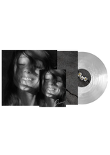 Ariana Grande Petal translucent pearly white vinyl record with signed art card displayed on a clean surface.