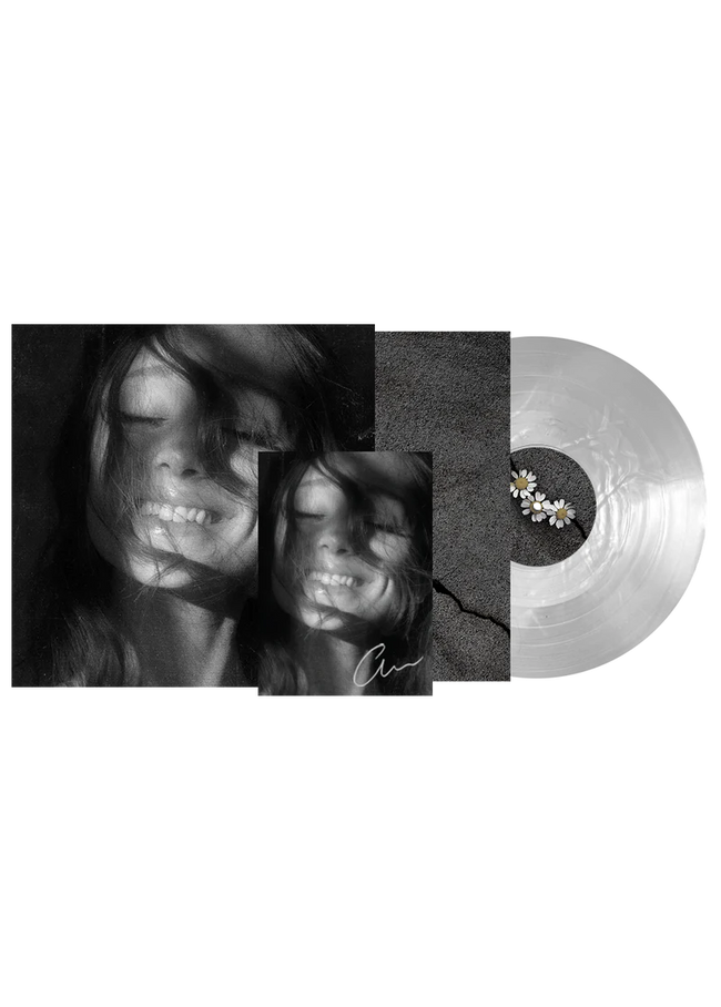 Ariana Grande Petal translucent pearly white vinyl record with signed art card displayed on a clean surface.