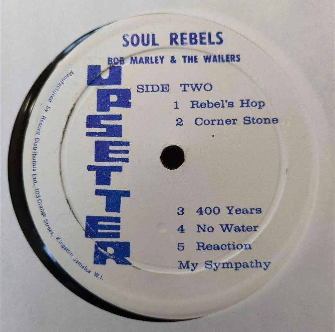 Bob Marley & The Wailers Soul Rebels vinyl LP pressed by Jamaican Upsetter, showing the album cover and vinyl inside.