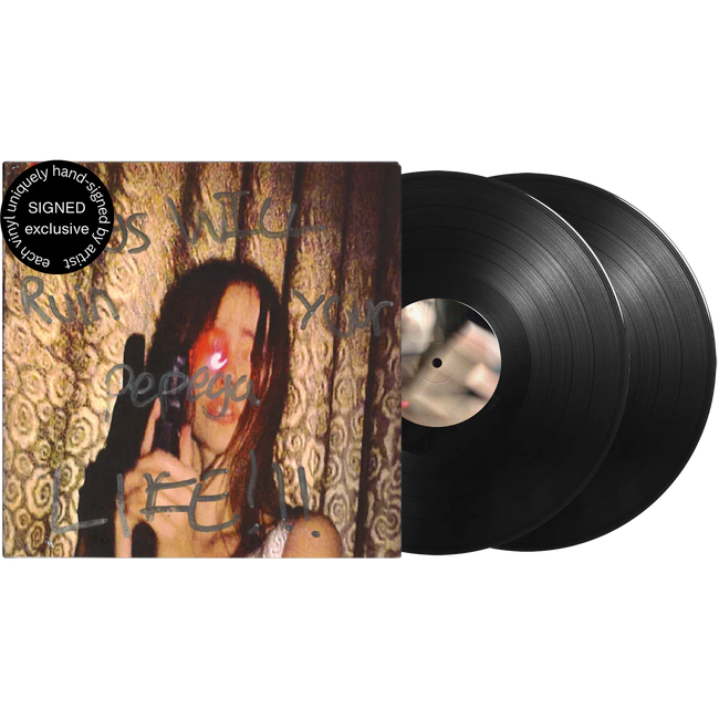Close-up of Fakemink Terrified Signed 2LP vinyl record on a TV screen, showcasing album cover art and signed inscription.